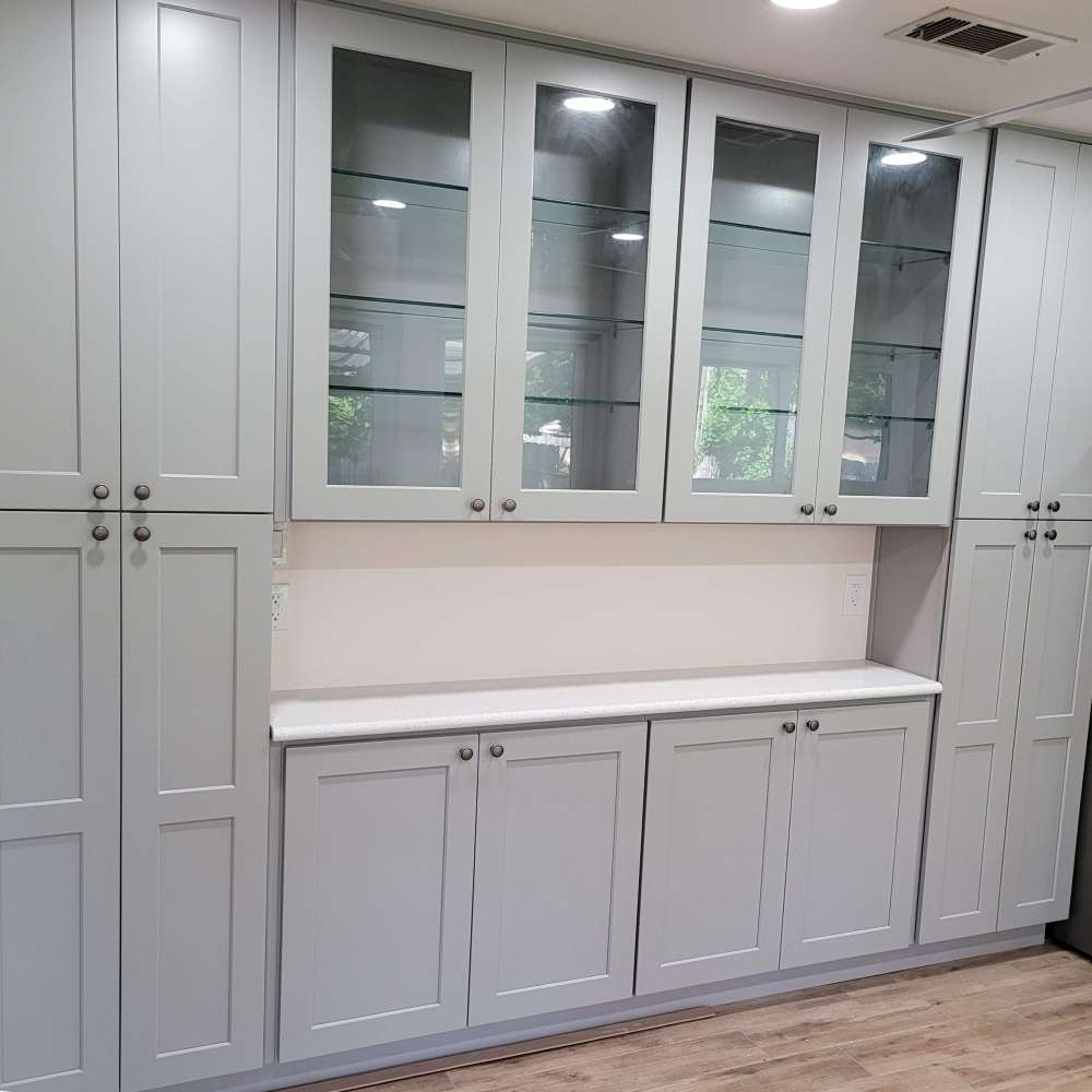 Clean Gray shaker style cabinets with clear glass doors uppers